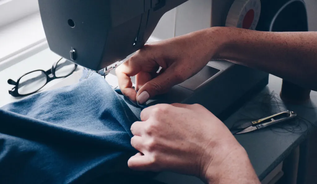 seamstress hemming jeans
