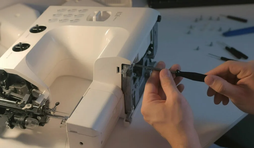 repairing a sewing machine