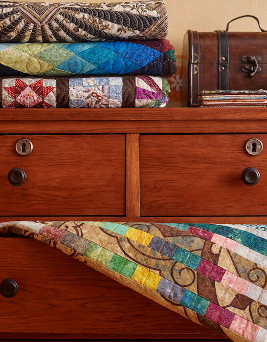 quilt hanging in a drawer cabinet