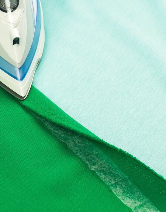 Hemming, shortening a green courtain fabric with an iron and the iron-on adhesive hemming tape - ss220726