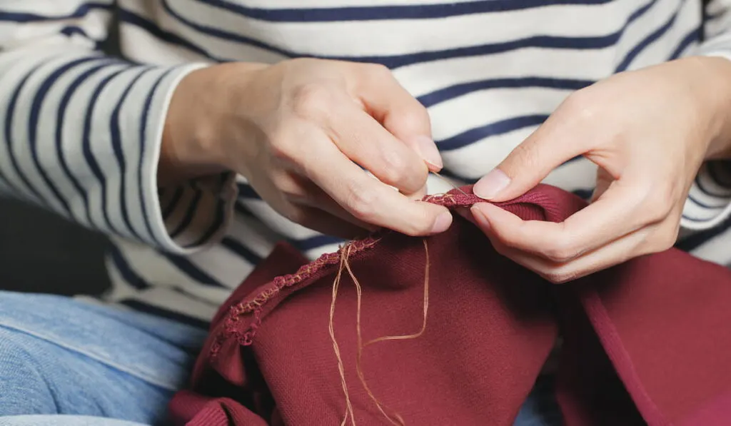 woman hand sewing