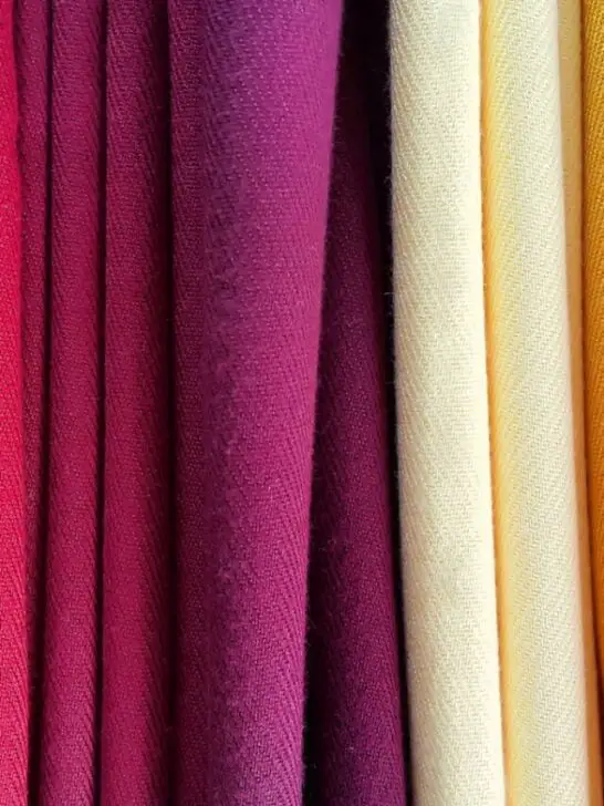 Bright multicolored background of fabrics - ee220903