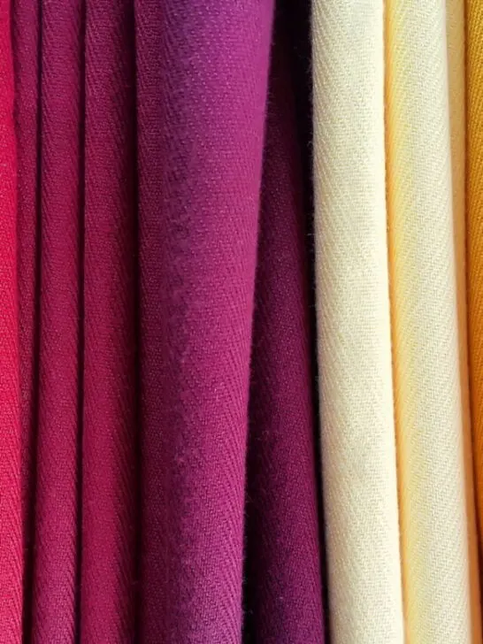 Bright multicolored background of fabrics - ee220903