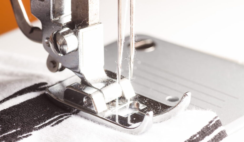  a sewing machine with twin needle