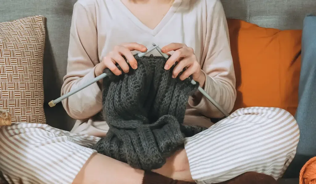 young woman knitting