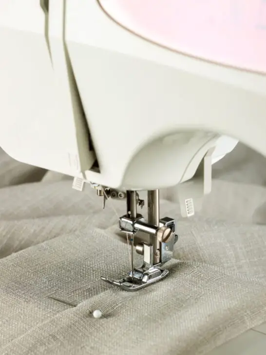 The modern sewing machine and item of clothing. sewing process - ee221208