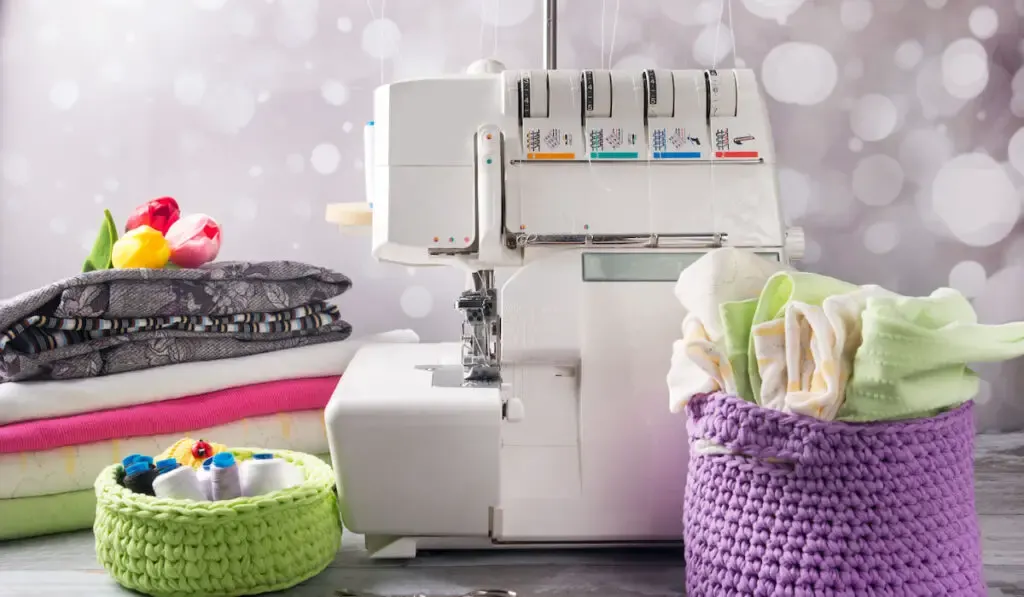 Overlock sewing machine and fabric stack on the table