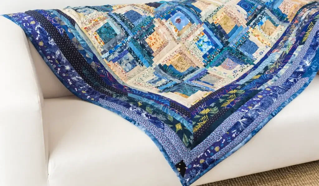 blue quilt on a sofa