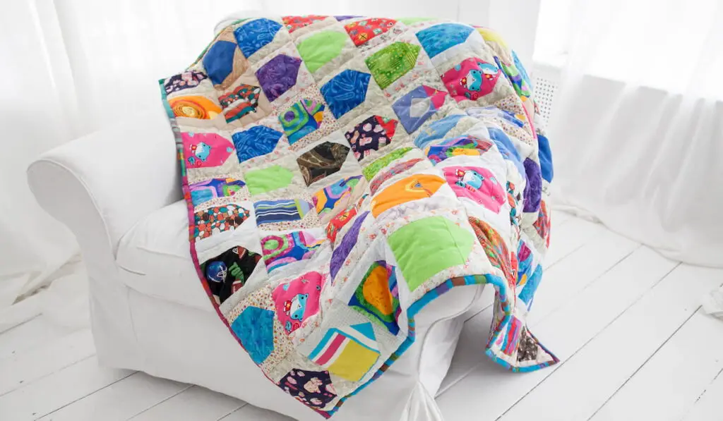 patchwork quilt on a white sofa