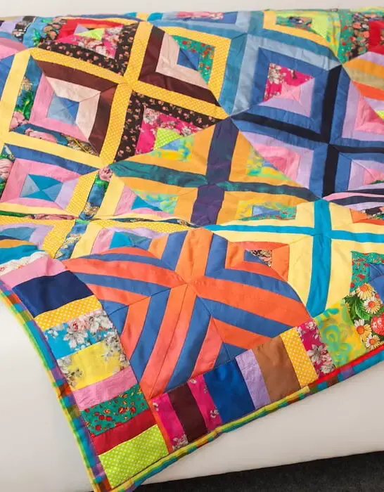 colorful quilt on a couch sofa