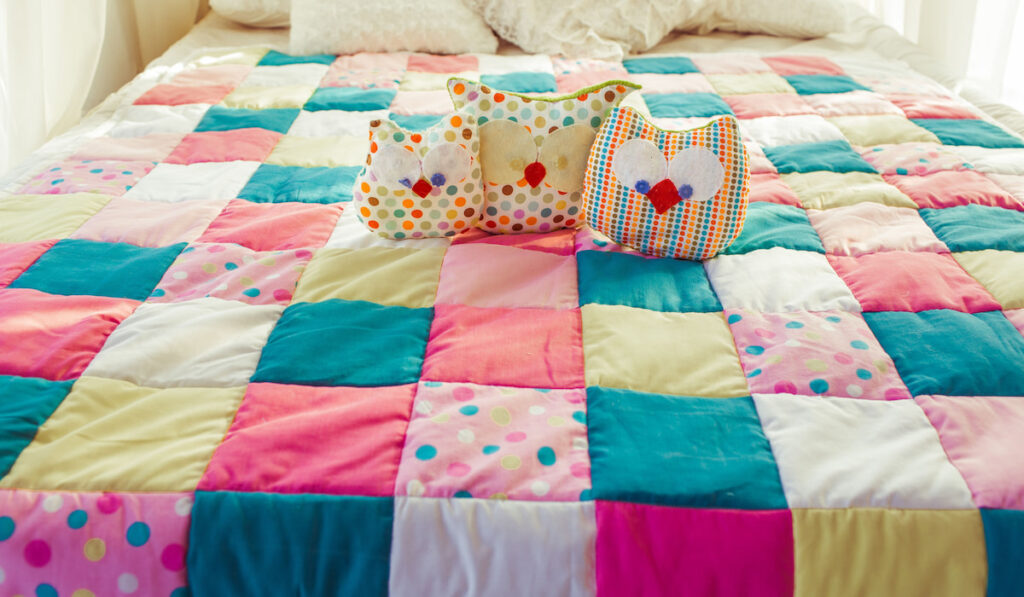 colorful patchwork quilt on the bed