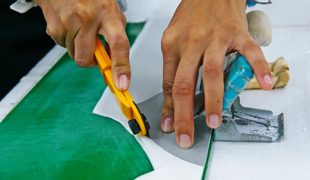 female hands cutting fabric