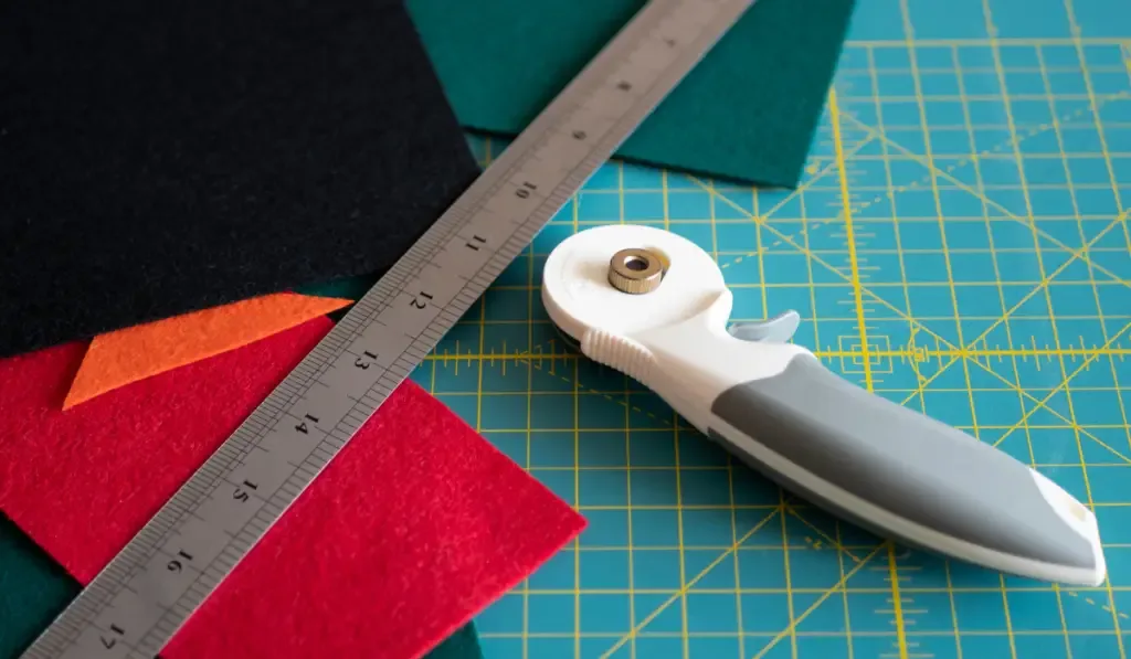  rotary cutter and a ruler on the cutting mat